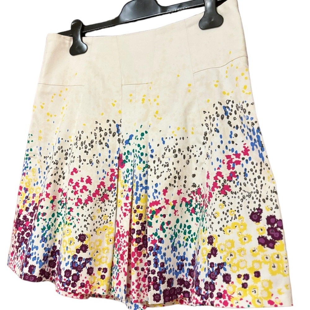 White with multicolor flowers. 
97% Cotton 
3% Spandex